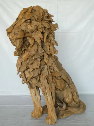 Product image of the product “Seated royal Lion made from teak root pieces. About 100cm length and 150cm height. ”